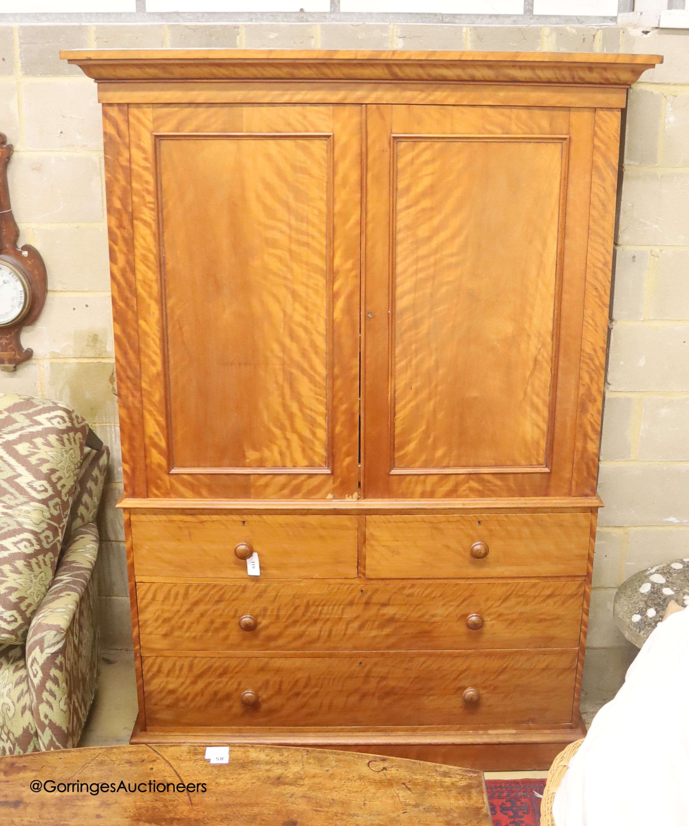 A Victorian satin birch linen press, width 137cm depth 57cm height 214cm